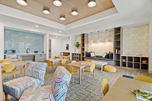 A room with a lot of chairs and tables.