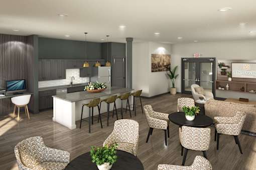 Modern resident lounge with a kitchen island, bar seating, and comfortable seating areas for gathering and relaxing.