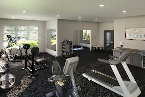Modern fitness center with cardio equipment, strength stations, and a simple, functional workout layout.