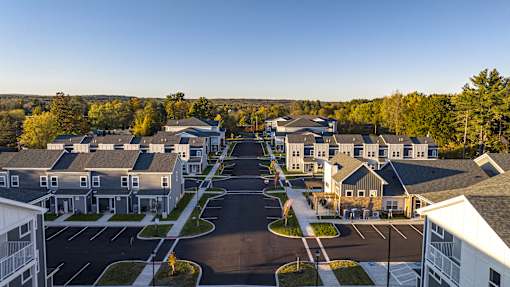 A row of houses with a road in between.