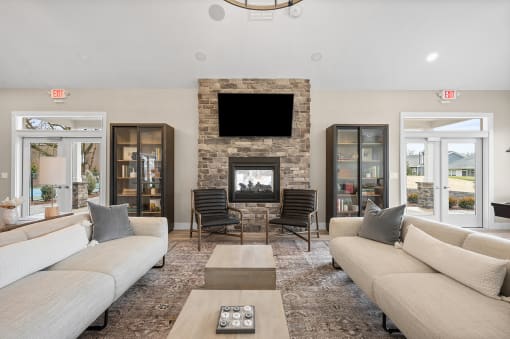 a living room with couches and a fireplace