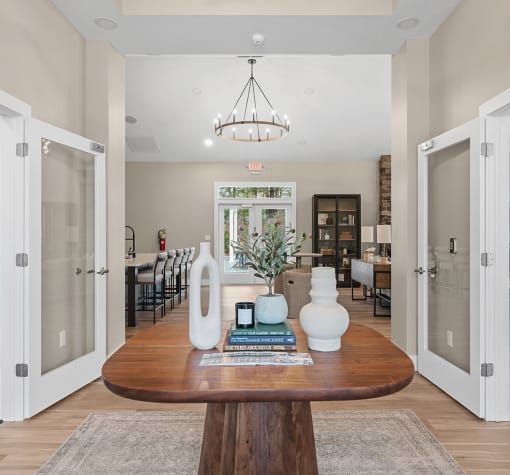 a dining room with a table and a chandelier