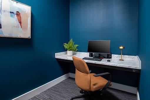 Modern conference room with a large meeting table, comfortable seating, and clean, contemporary finishes, designed for group meetings and collaboration.