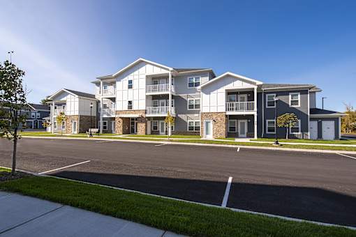 A large apartment complex with multiple buildings and parking lots.