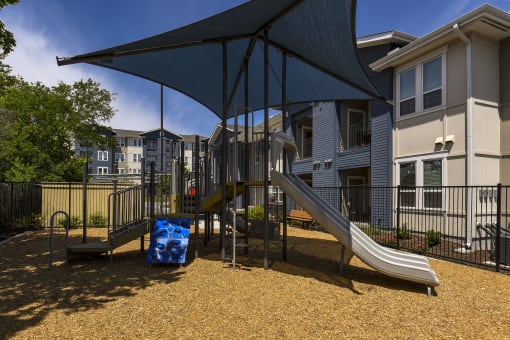 a playground at the whispering winds apartments in pearland, tx