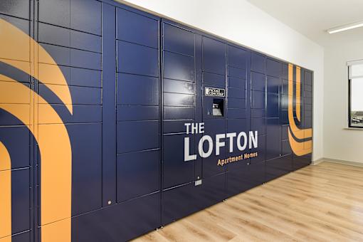 Secure resident mail room with organized mailboxes and package storage for convenient and private parcel pickup.