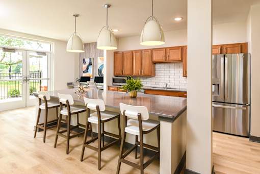 A kitchen with wooden cabinets and a white countertop.