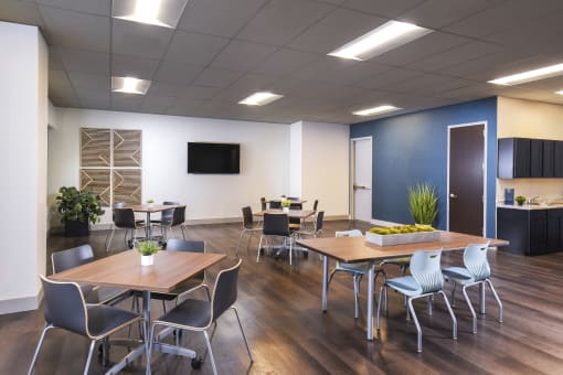 a conference room with tables and chairs