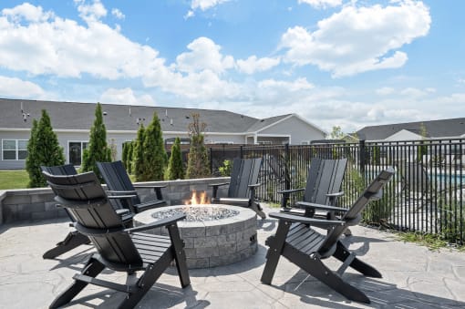 patio with chairs and fire pit
