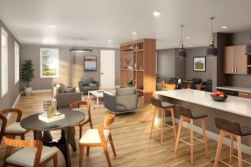 A modern kitchen and dining area with wooden floors and furniture.