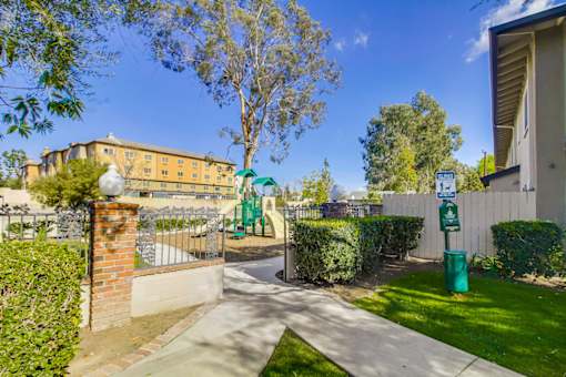 A sunny day in a residential area with a clear blue sky.