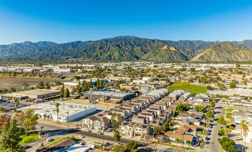 A suburban area with a mountain range in the background.