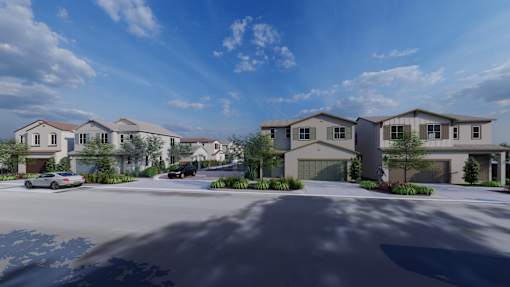 A row of houses with cars parked in front.