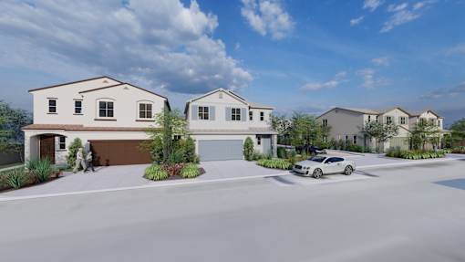 A row of houses with a car parked in front of them.