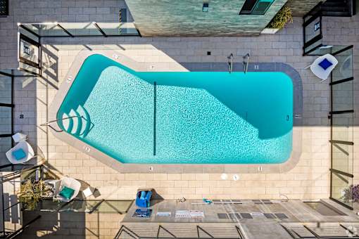 A rectangular pool with a blue tiled border.