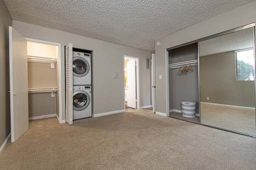 A laundry room with a washer and dryer.