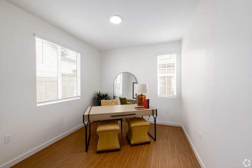 A white room with a table and chairs.