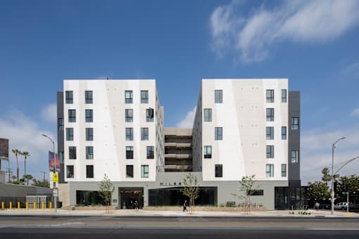 A modern building with a white facade and black accents.