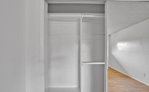 A white refrigerator with a shelf and a door open.