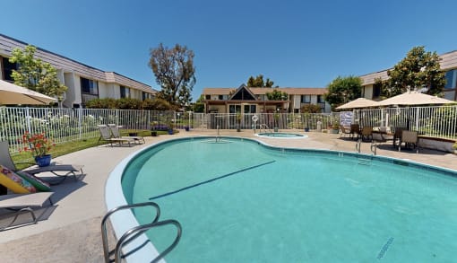 our apartments have a large pool with chairs and umbrellas