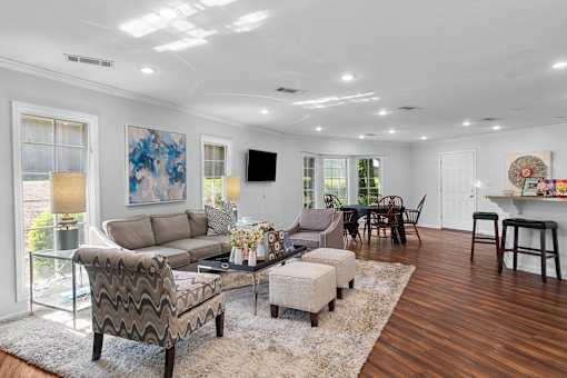 A living room with a grey sofa and a coffee table.