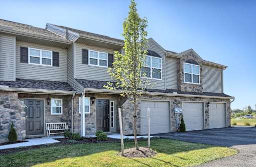vinyl siding and stone entrances