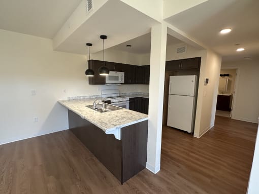 a view of a kitchen with a sink and a counter top