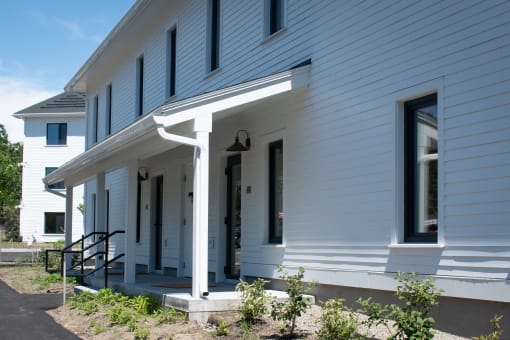 a view of the front porch of a white house
