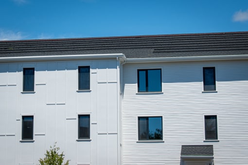a white building with a blue sky in the background