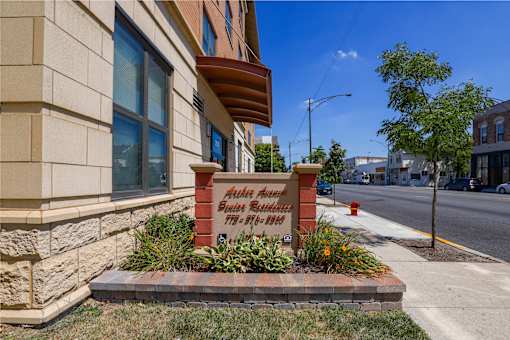 A sign in front of a building that says "Miller's Suites Bed & Breakfast".