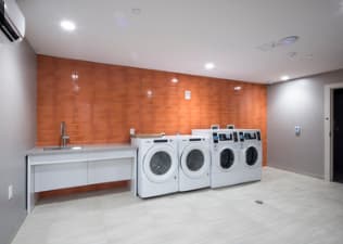 A laundry room with a washer and dryer.