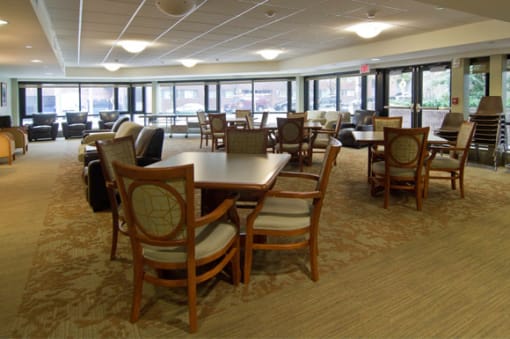 a large dining room with tables and chairs