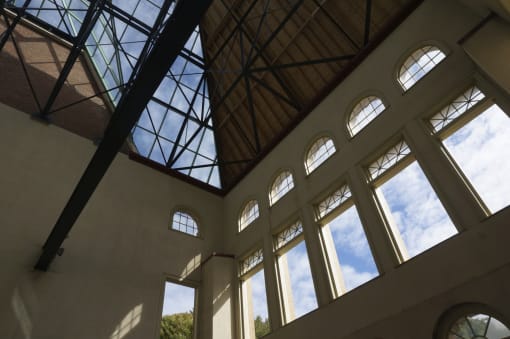 a view of the sky from inside a building with large windows