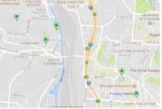 a screenshot of a map of a city with green dots on it