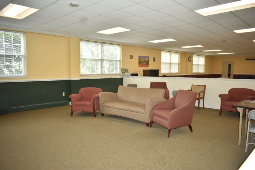 a waiting room with chairs and a table
