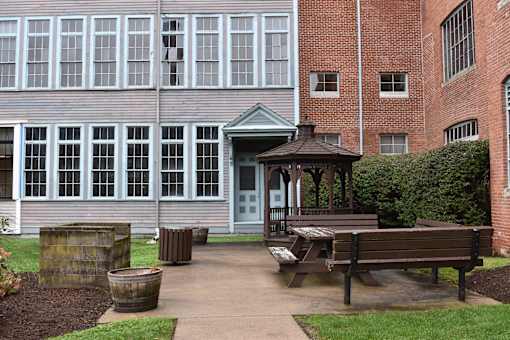 a gazebo sitting in front of a building