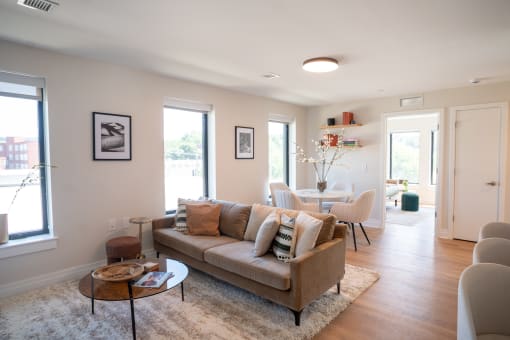 a living room and dining room with a couch and a table