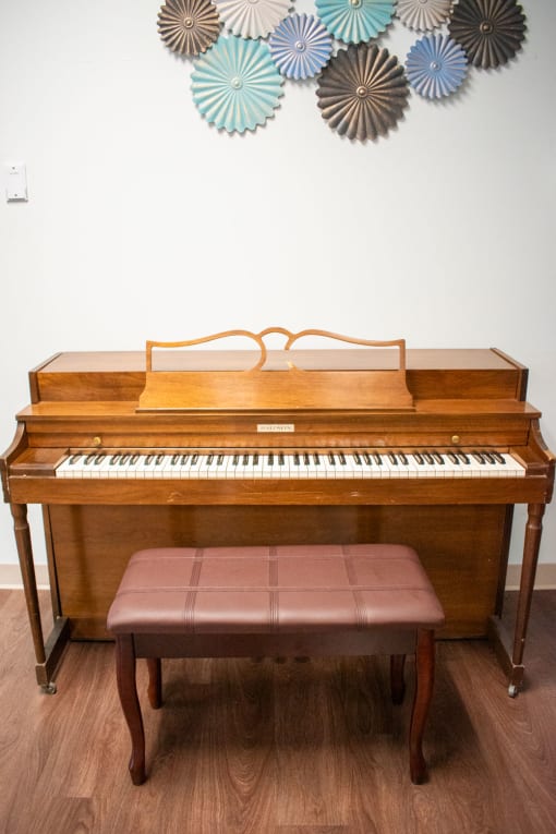 a piano with a bench in front of it