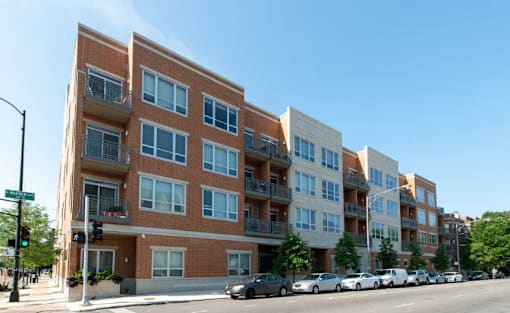 a building on a city street with cars parked in front of it