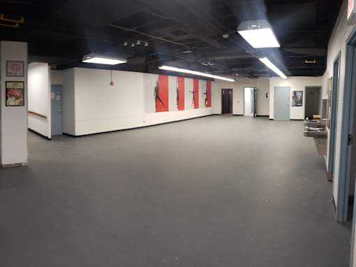 A long hallway with a red flag on the wall.