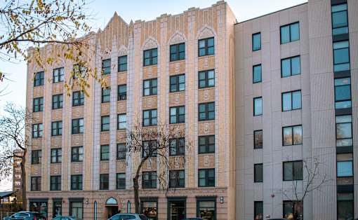 A large building with a unique design on the side.