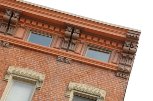 the facade of a brick building with windows