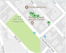 a map of a neighborhood with green markers on it
