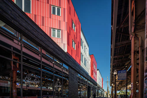 A red building with a clear blue sky in the background.