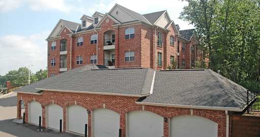 Luxury apartments with red brick exterior, garages available, and scenic views in Minnetonka, Minnesota