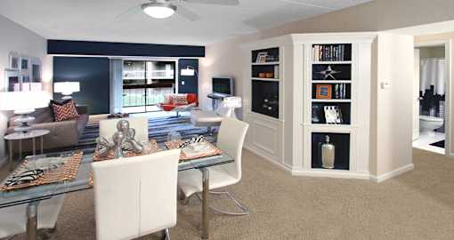 Spacious apartment in central Omaha with condo-style layout, colored feature wall, and built-in shelves at Embassy Park Apartments