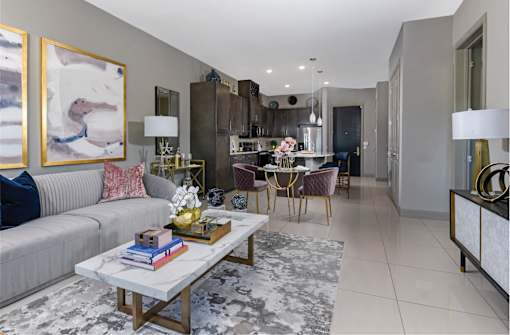 Spacious luxury apartments with porcelain tile floors, dark wood cabinets, and granite countertops at Xenia Apartments in Golden Valley, Minnesota