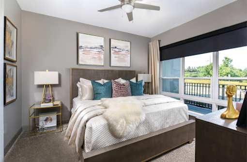 Luxury bedroom with walk-in closet and scenic views at Xenia Apartments in Golden Valley, Minnesota