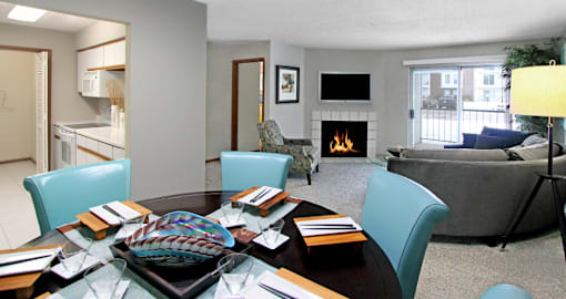 Spacious floor plan, open floor plan, spacious apartment with woodburning fireplace, spacious kitchen, spacious dining room, and bright white kitchen at The Vanderbilt Apartments in Omaha, Nebraska