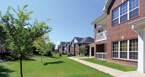 Luxury townhomes with attached garages, scenic views and red brick exteriors at Bellemeade Apartments in west Des Moines